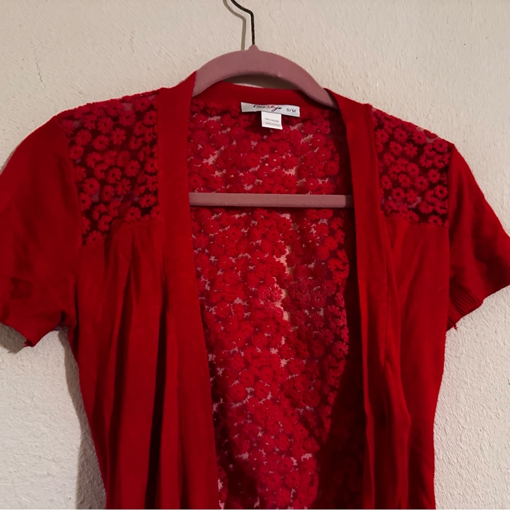 Coco Roja red lace and knit like flower design 100% viscose wrap. Made in China